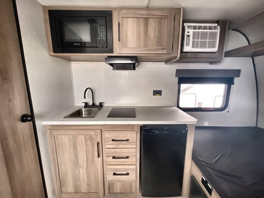 Compact appliances in small RV kitchen