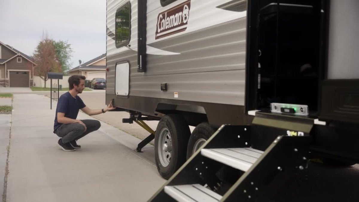 Person inspecting travel trailer