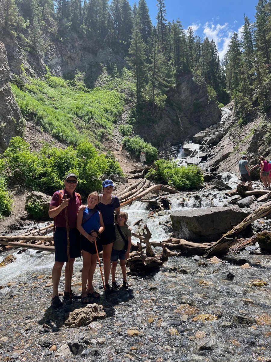 Toddler friendly hikes Utah creek crossing with mountain scenery