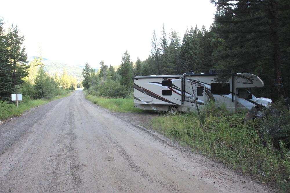RV parked on forest road pullout