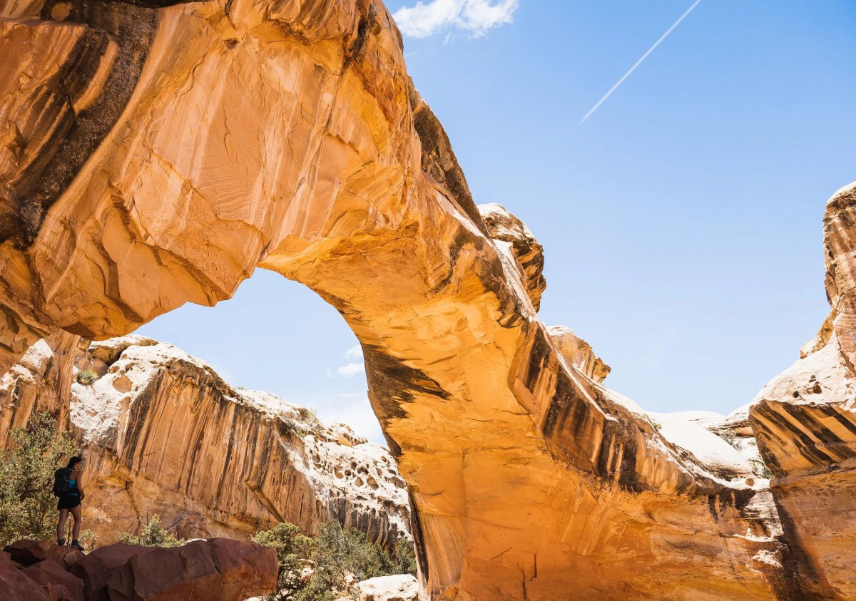 Toddler friendly hikes Utah sandstone arch trail under blue sky