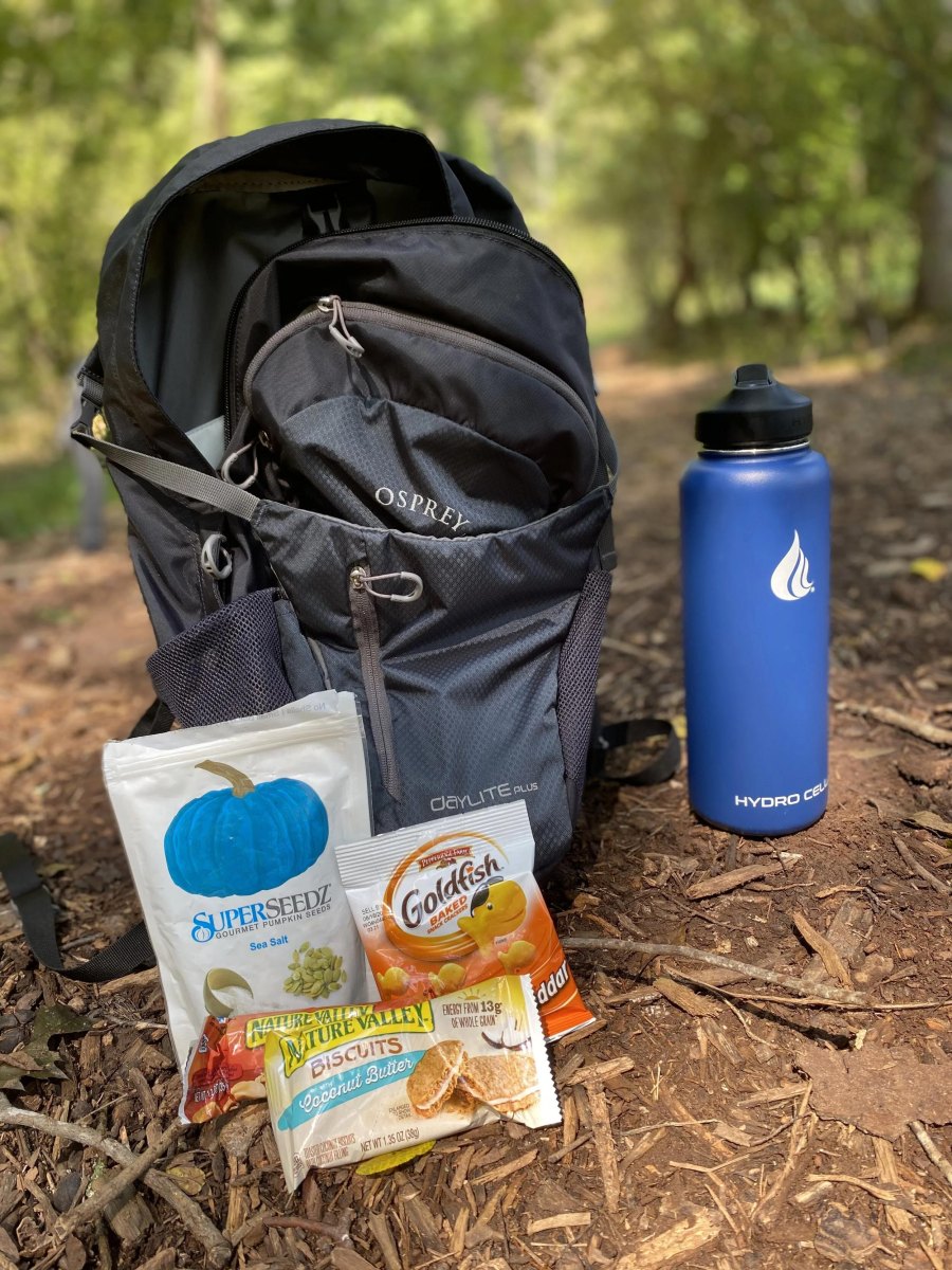 Hiker with snacks and water bottle