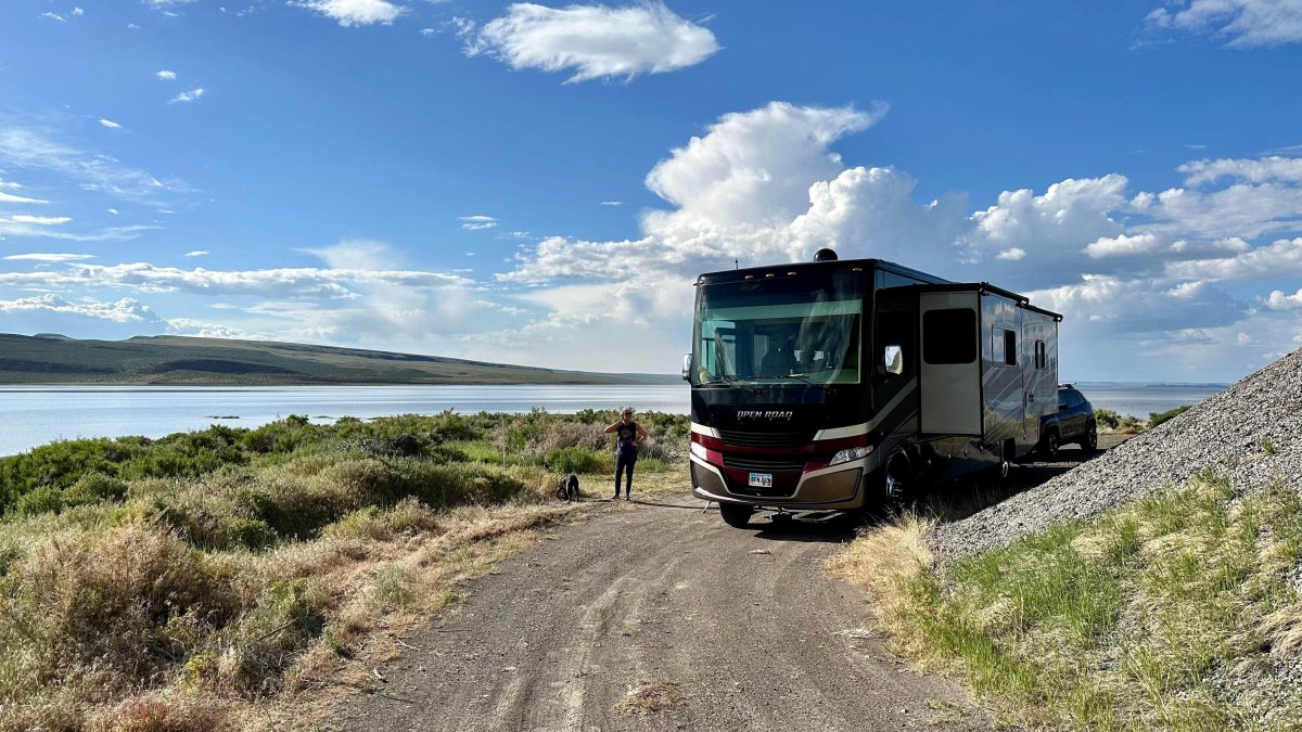 RV beside remote lake campsite