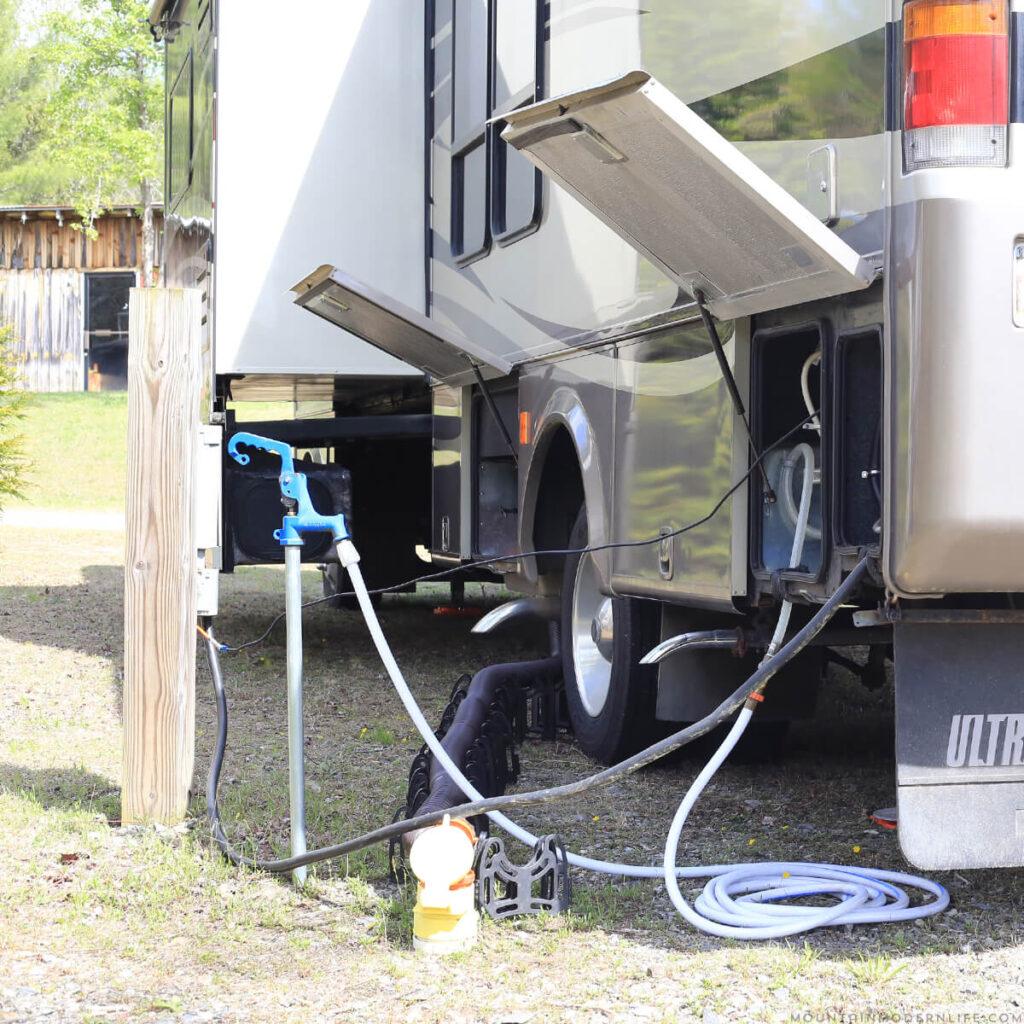 RV connected to water and electrical hookups