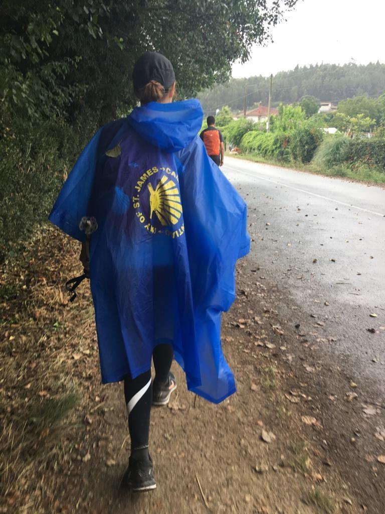 Camino pilgrim wearing rain protection