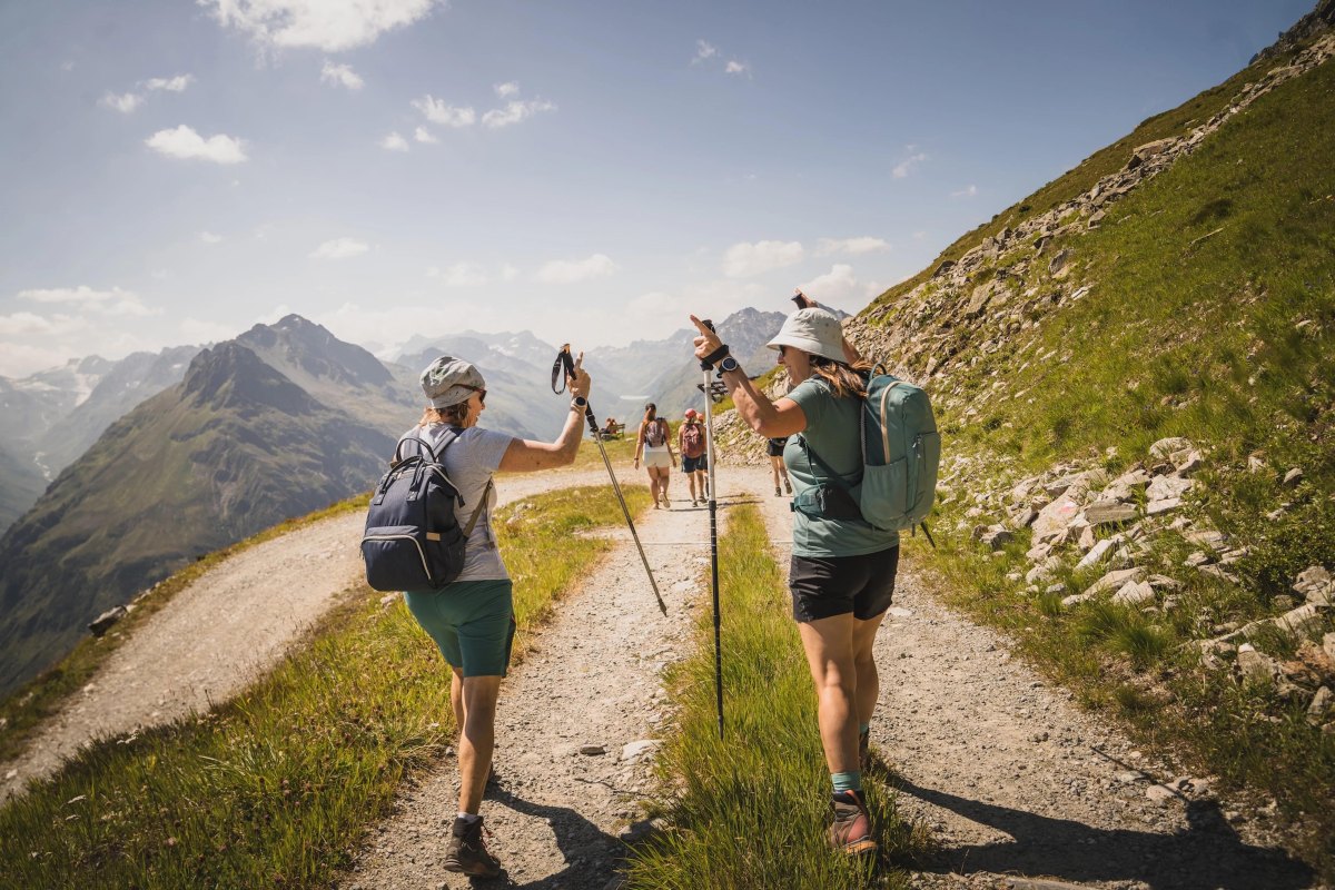 Hikers sharing forest path