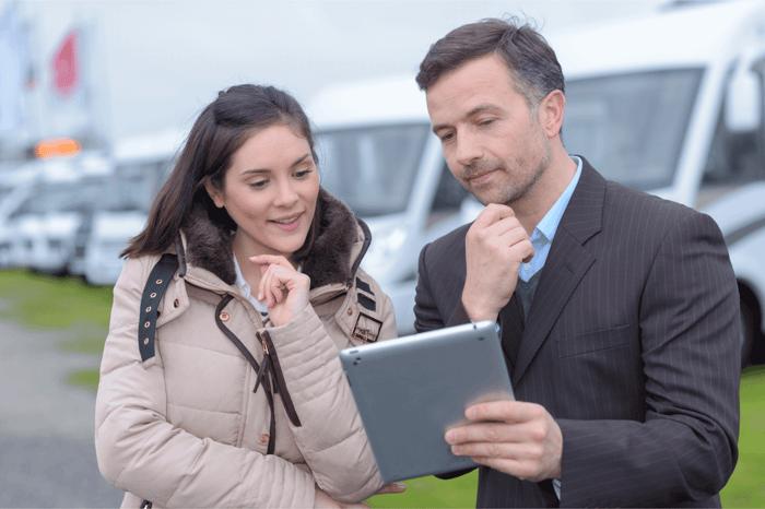 Couple comparing RV purchase options