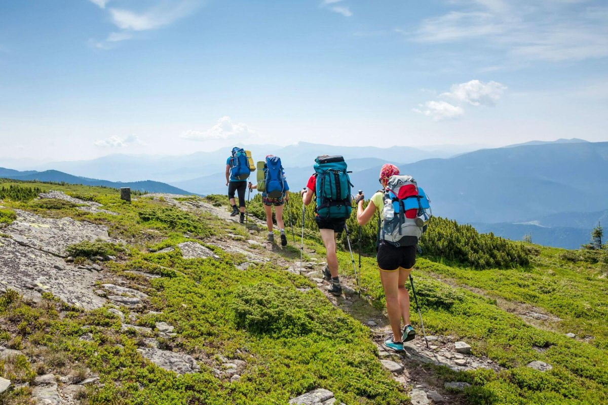 Backpackers hiking together safely