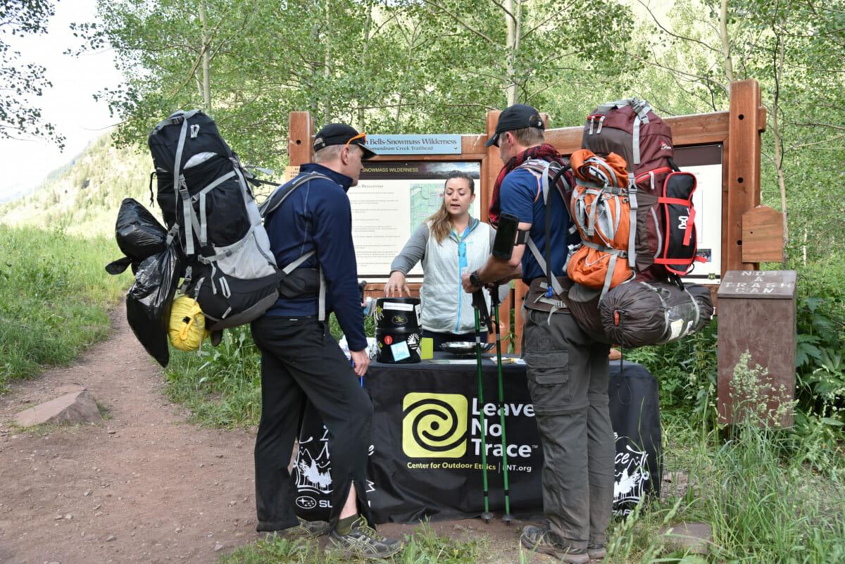 Hikers discussing conservation tips