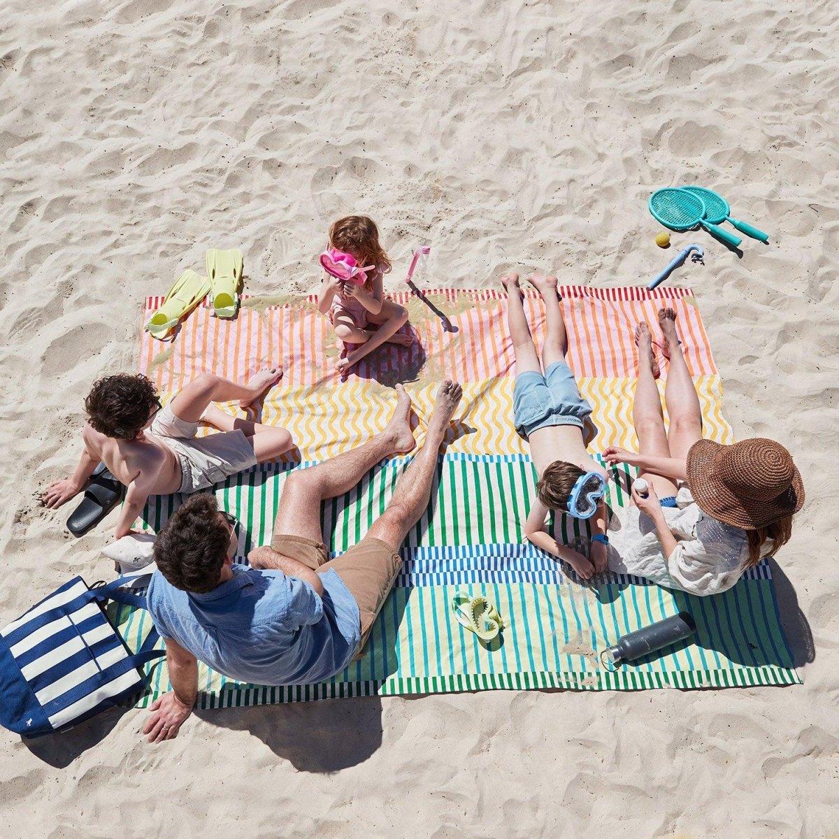 Beach towels and mats on sand