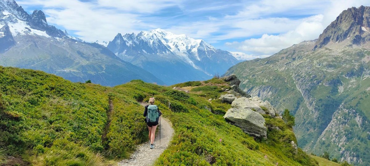 Hiker walking on mountain trail