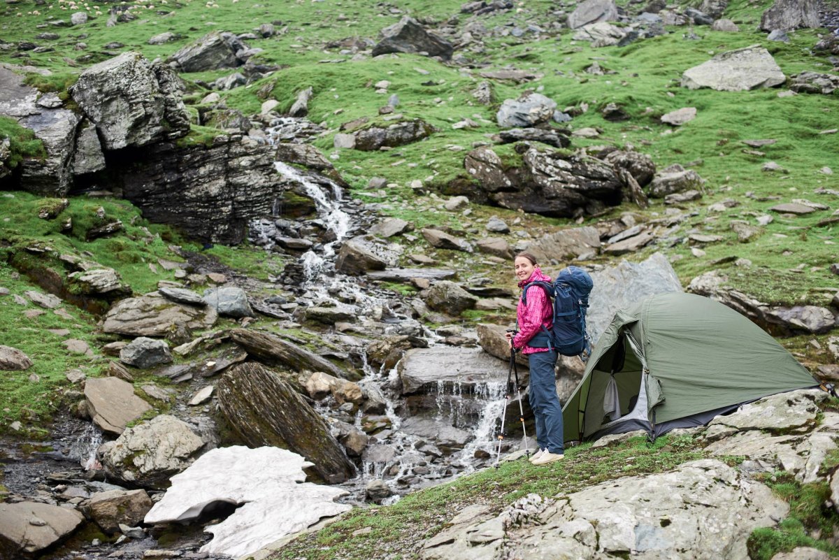 Hiker near mountain stream